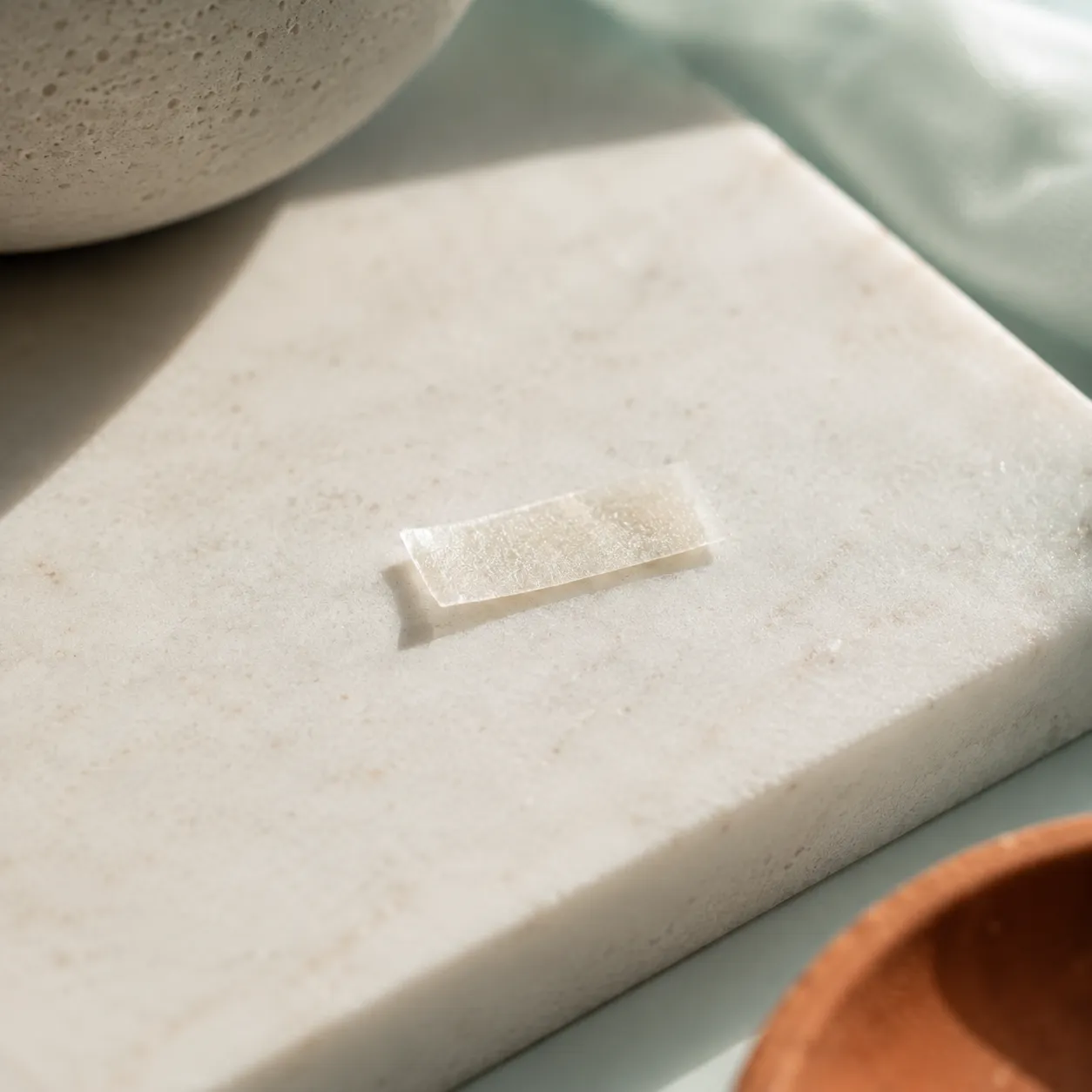 A single dissolving strip on marble in shallow depth of field